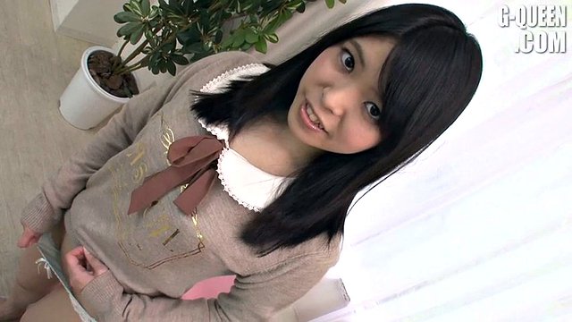 Cute Japanese sweetheart posing in her adorable white tunic