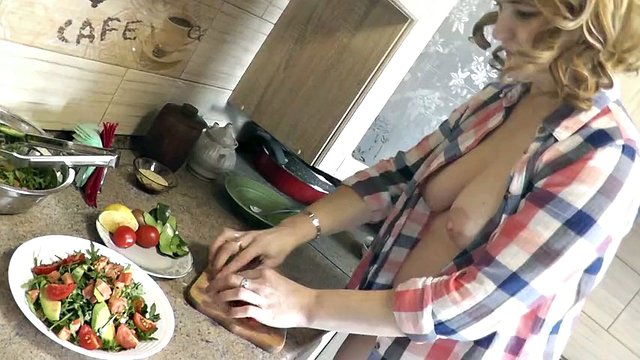 Milf sexy Platinum continues naked cooking in kitchen preparing salad for Christmas without panties  high heels. Naked in public