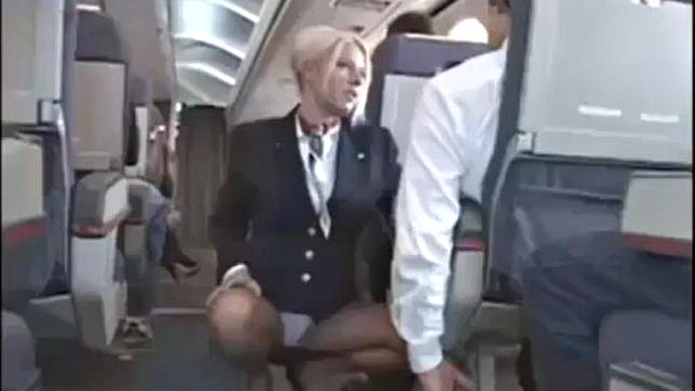 Handjob in airplane with sexy stewerdess
