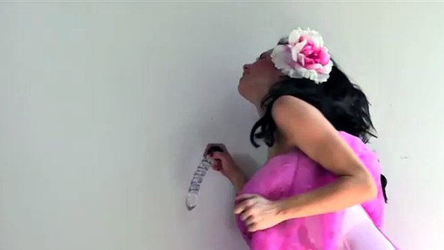 Veronica Avluv puts on a glass dildo