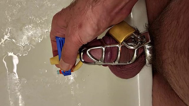 Pissing with a catheter locked in a chastity cage