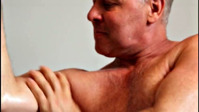 Fitness muscular sport daddy bodybuilder Studio bizeps strong man weightlifter oil massage fit