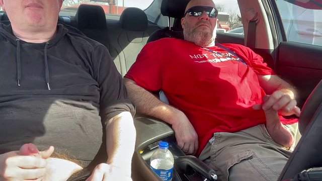 Stroking our dicks in the car in the parking lot