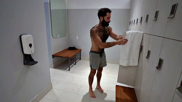 Hairy guy masturbates in the gym locker room