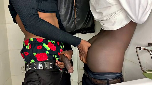 Horny African guys fuck in the bathroom while on duty
