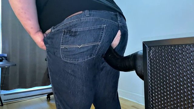 Fully clothed superchub rides a dildo