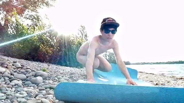 Slim nudist boy doing yoga naked on a nudist beach. Nude yoga video by John Artin, gay porn model, skinny naturist, twink, practice