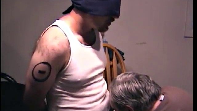 Blindfolded dude receives a blowjob from a mature twink