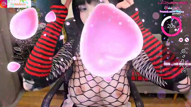 Tattooed Redhead Masturbates Bare Body in Fishnets While Smooth Dildo Slips Between Thighs