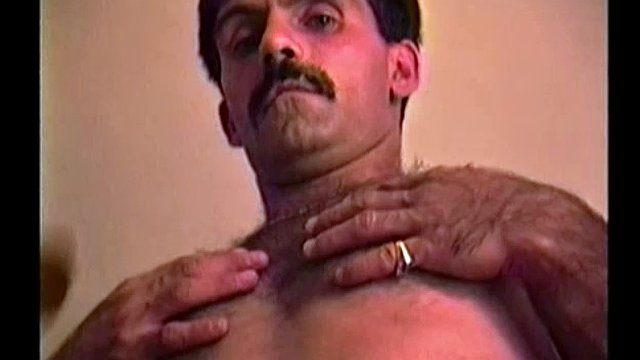 Stuck in traffic, I noticed Gabe alongside me. So, I thought "what the hell" and gave him my card. A few days later this handsome and hairy man is naked and stroking his hard uncut cock in my apartment.